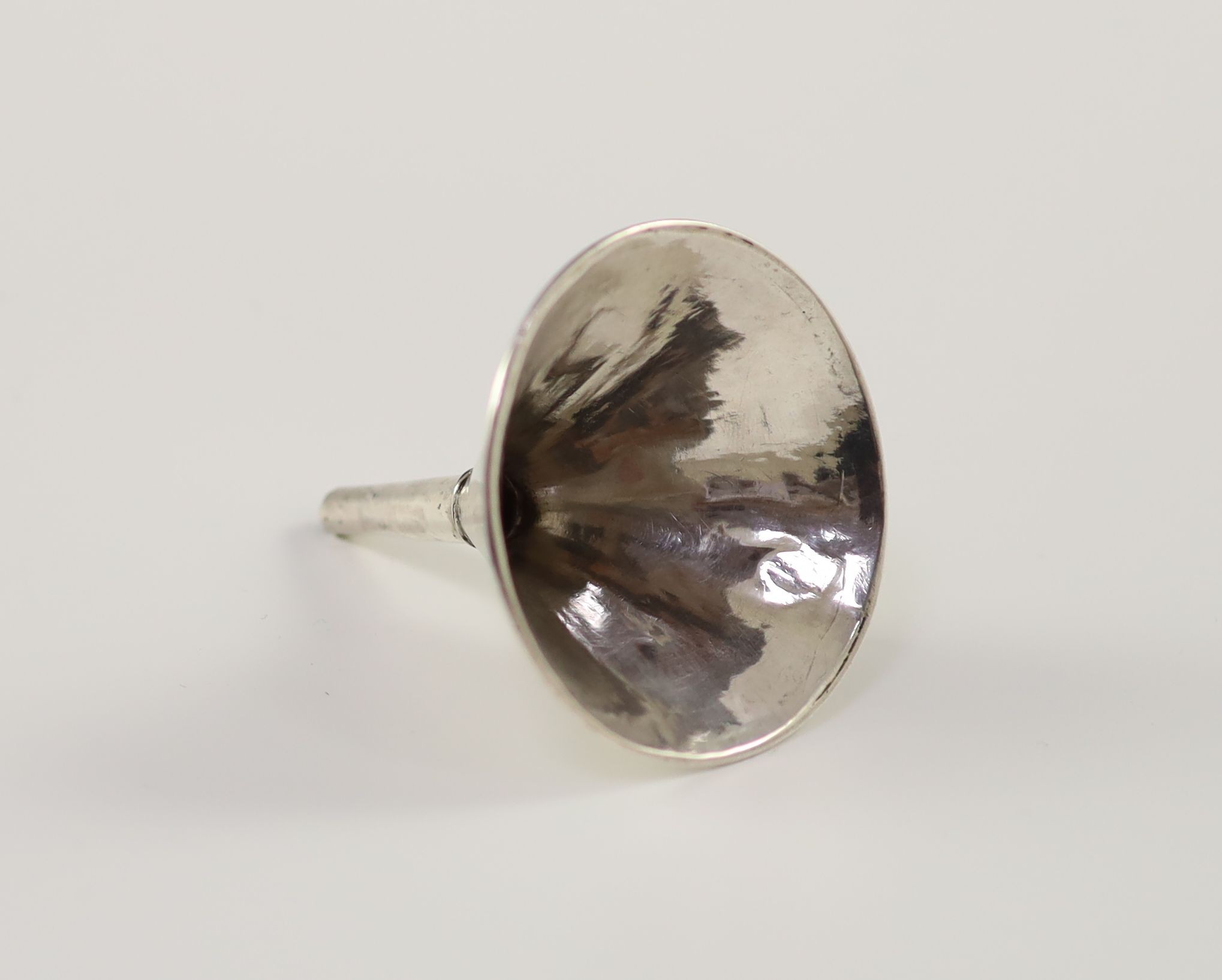 A Queen Anne small Britannia standard silver scent funnel